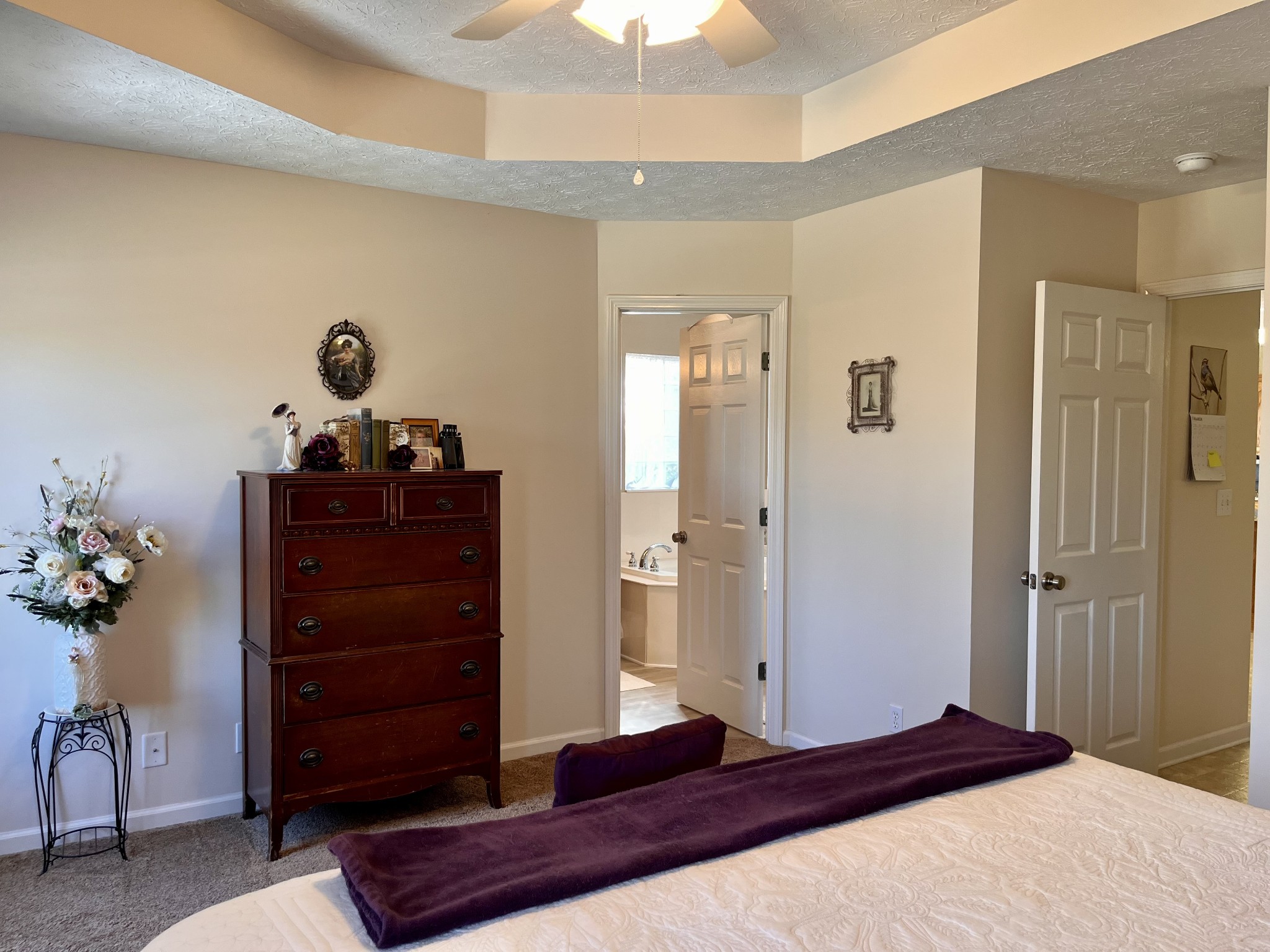 4869 Starks Road Cross Plains, TN 37049 - Photo 31 of 46 a bedroom with a bed and a chandelier