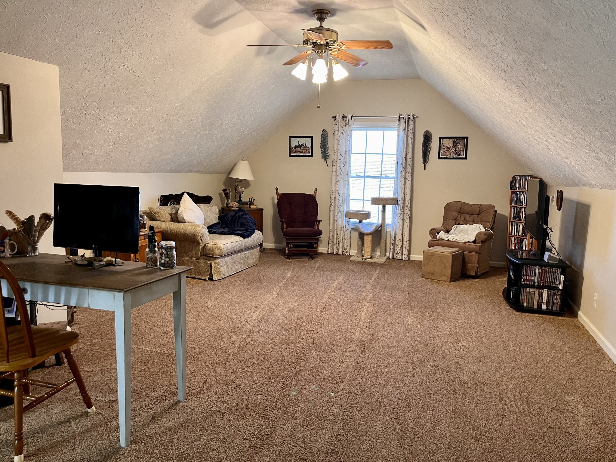 4869 Starks Road Cross Plains, TN 37049 - Photo 37 of 46 a living room with furniture a window and a flat screen tv