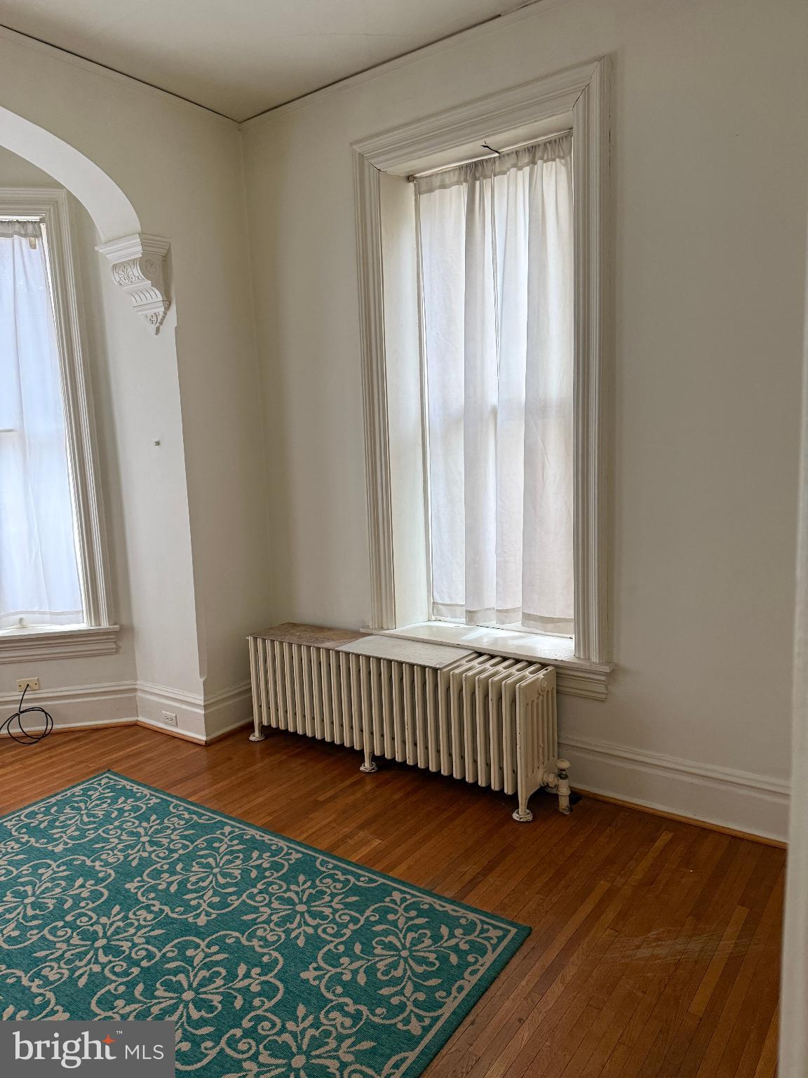 232 West Main Street, Unit 4 Waynesboro, PA 17268 - Photo 5 of 12 a view of an empty room with wooden floor and a window