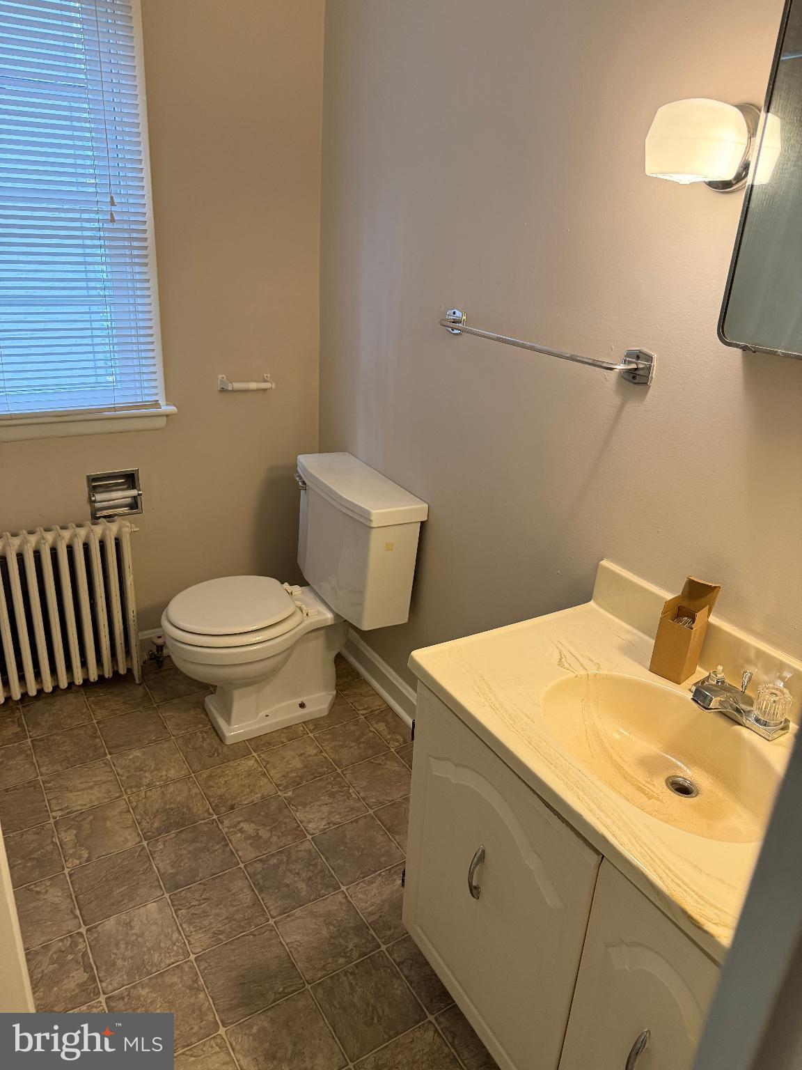232 West Main Street, Unit 4 Waynesboro, PA 17268 - Photo 10 of 12 a bathroom with a sink toilet and vanity