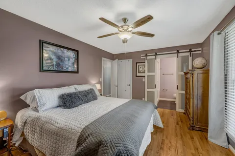 a living room with furniture rug and wooden floor