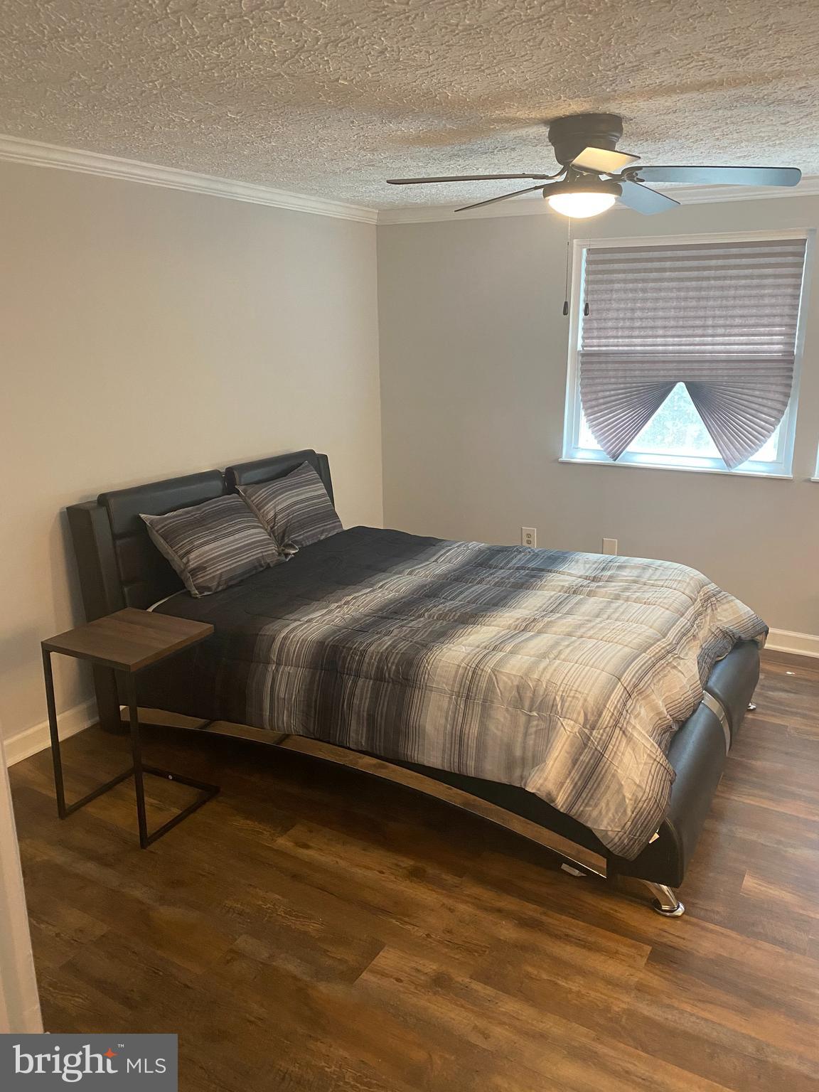 7 Capland Court Perry Hall, MD 21128 - Photo 6 of 7 a bed sitting in a bedroom next to a window