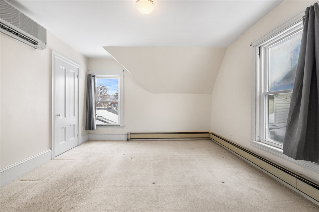 34 Paris Street Everett, MA 02149 - Photo 15 of 25 a view of an empty room with a window