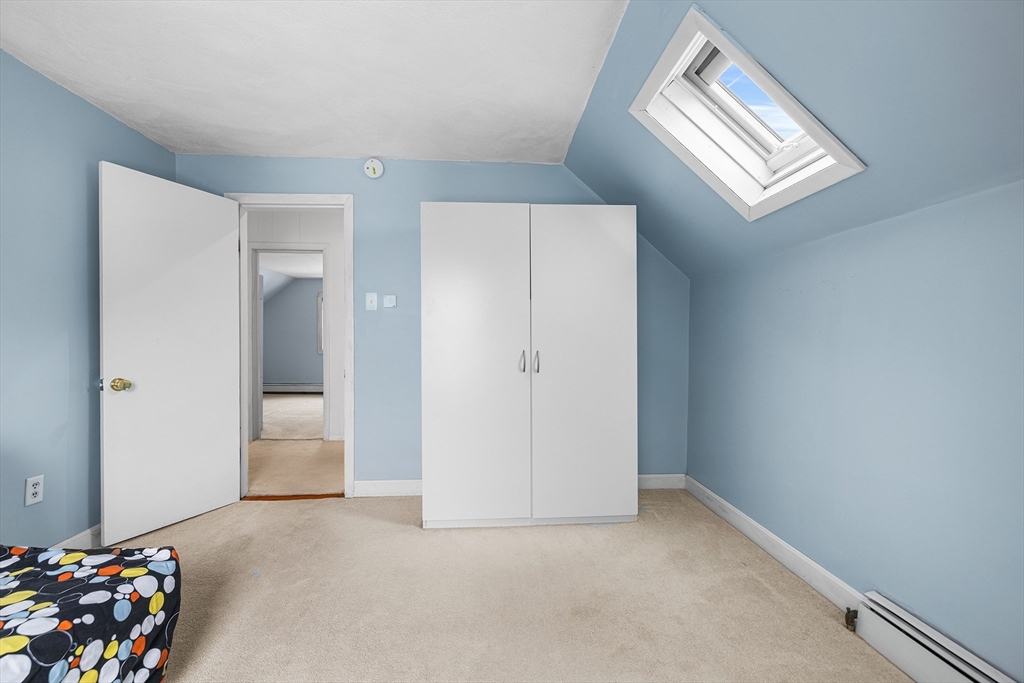 34 Paris Street Everett, MA 02149 - Photo 19 of 25 a view of an empty room and a window