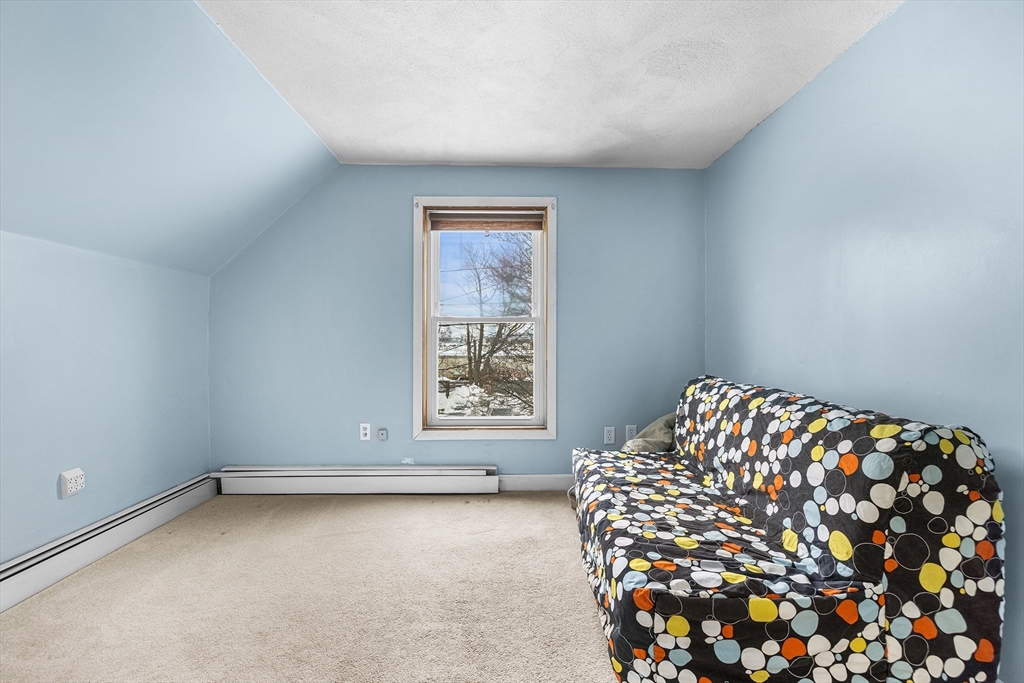 34 Paris Street Everett, MA 02149 - Photo 20 of 25 a bedroom with a bed and a window