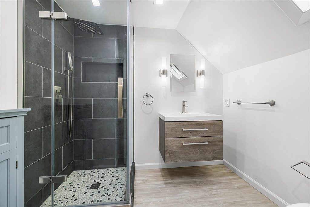 34 Paris Street Everett, MA 02149 - Photo 21 of 25 a bathroom with a sink and a mirror