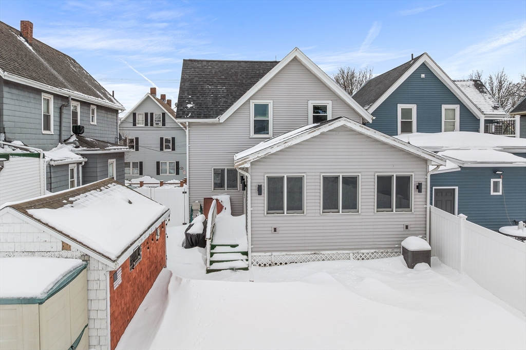 34 Paris Street Everett, MA 02149 - Photo 23 of 25 a front view of a house with a yard