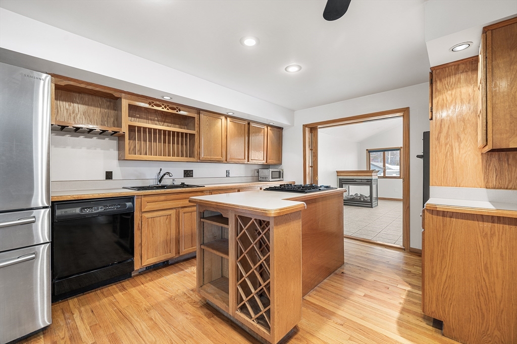 34 Paris Street Everett, MA 02149 - Photo 4 of 25 a kitchen with stainless steel appliances granite countertop a stove a sink dishwasher and a refrigerator