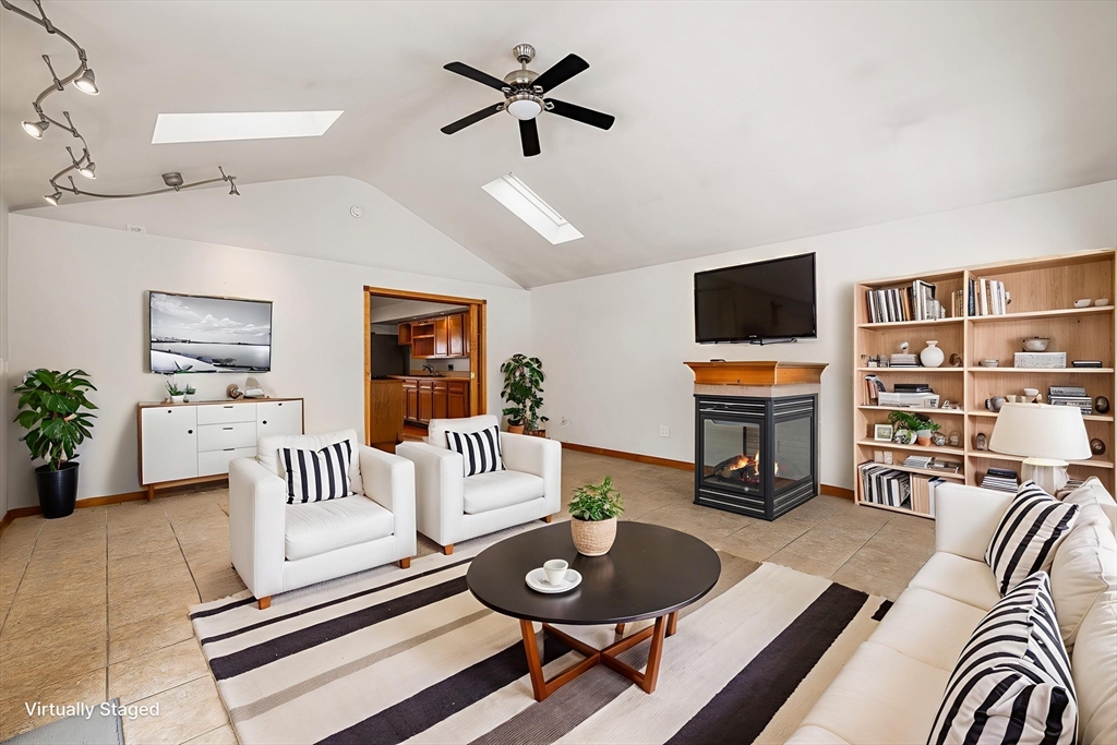 34 Paris Street Everett, MA 02149 - Photo 7 of 25 a living room with furniture and a flat screen tv