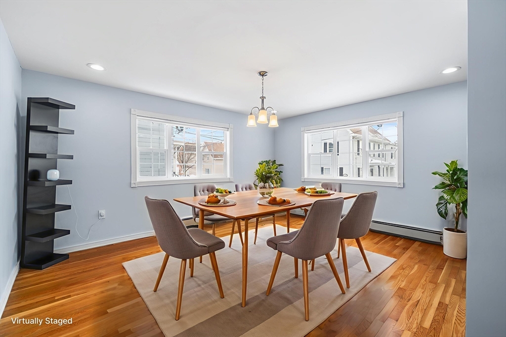 34 Paris Street Everett, MA 02149 - Photo 9 of 25 a view of a dining room with furniture window and wooden floor