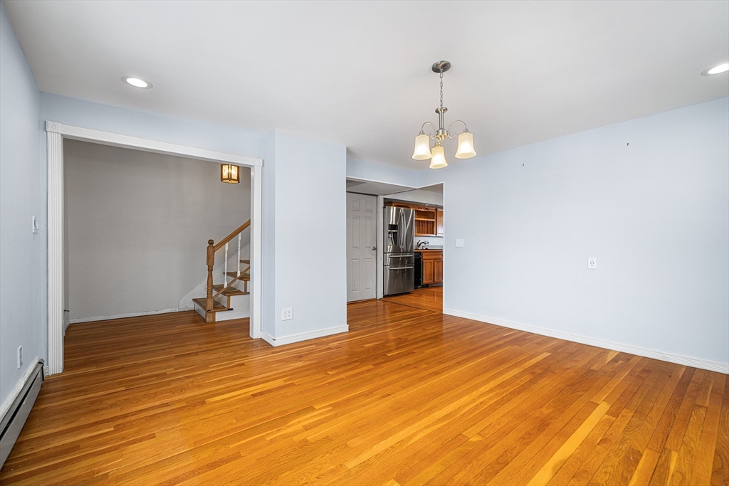 34 Paris Street Everett, MA 02149 - Photo 10 of 25 wooden floor in an empty room with a window