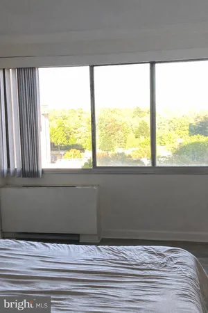 a bedroom with a bed and closet