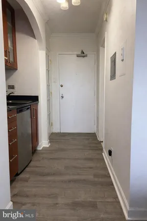 a white toilet sitting next to a bath tub and a shower