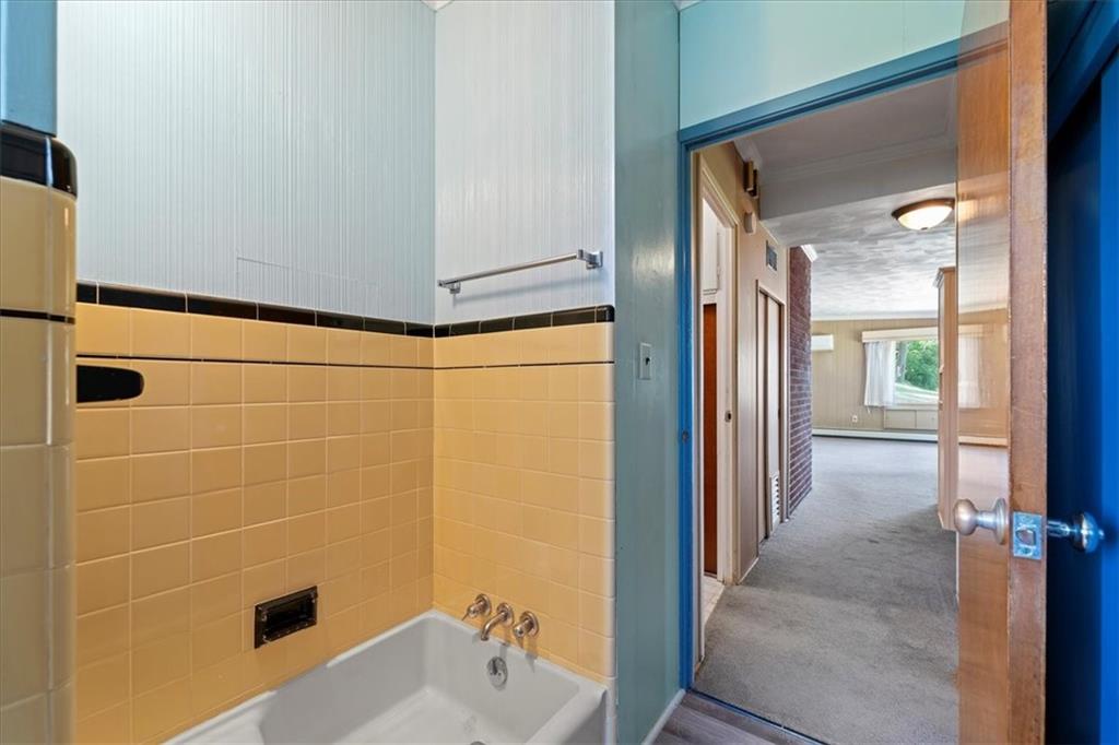 1143 Altman Road Jeannette, PA 15644 - Photo 12 of 50 a bathroom with a shower and a sink