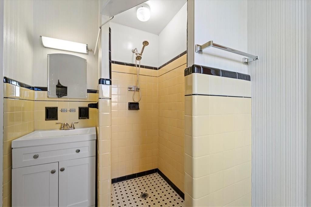 1143 Altman Road Jeannette, PA 15644 - Photo 16 of 50 a bathroom with a sink a mirror and a shower