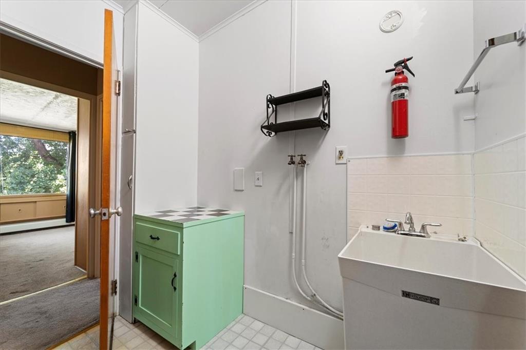 1143 Altman Road Jeannette, PA 15644 - Photo 17 of 50 a room with cabinets and washer