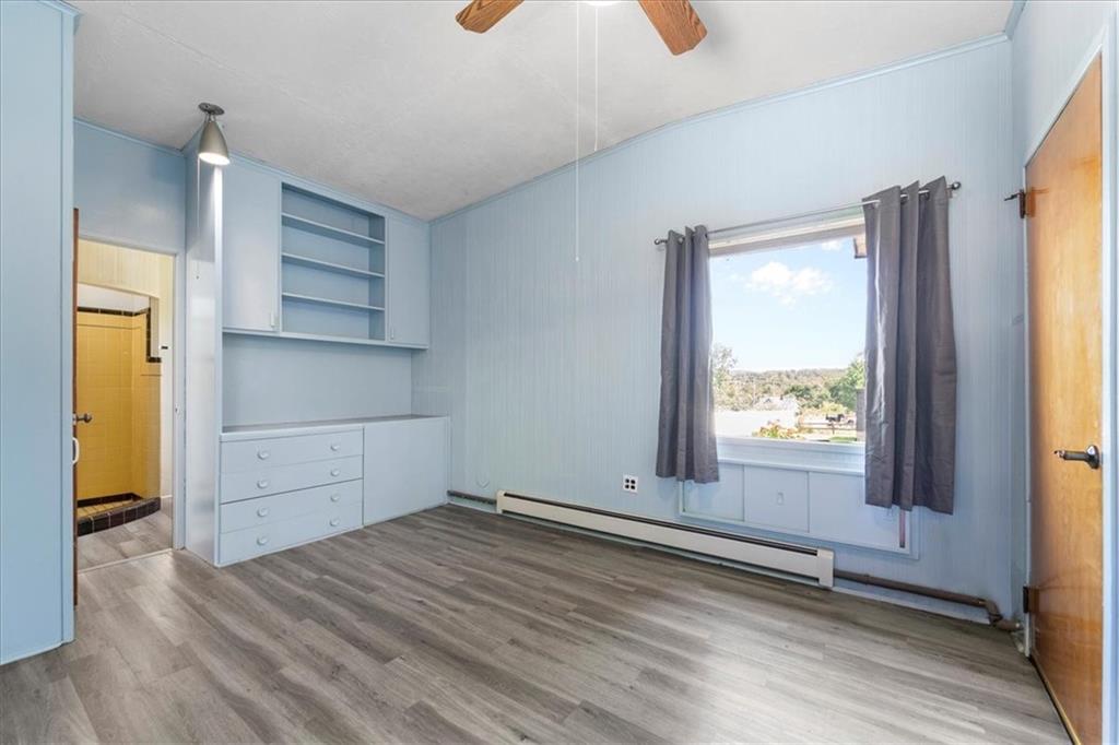 1143 Altman Road Jeannette, PA 15644 - Photo 21 of 50 a view of empty room with wooden floor and fan
