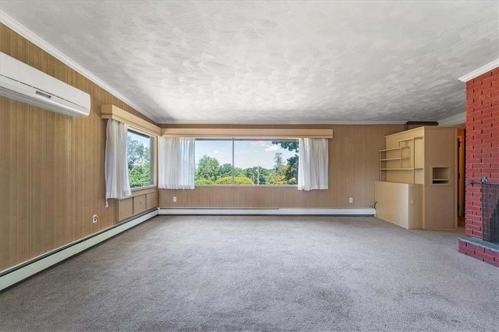 1143 Altman Road Jeannette, PA 15644 - Photo 28 of 50 a view of a big room with windows and refrigerator
