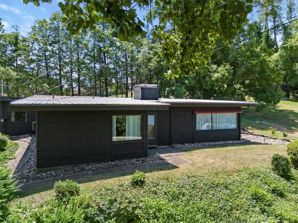 1143 Altman Road Jeannette, PA 15644 - Photo 3 of 50 a front view of a house with a yard