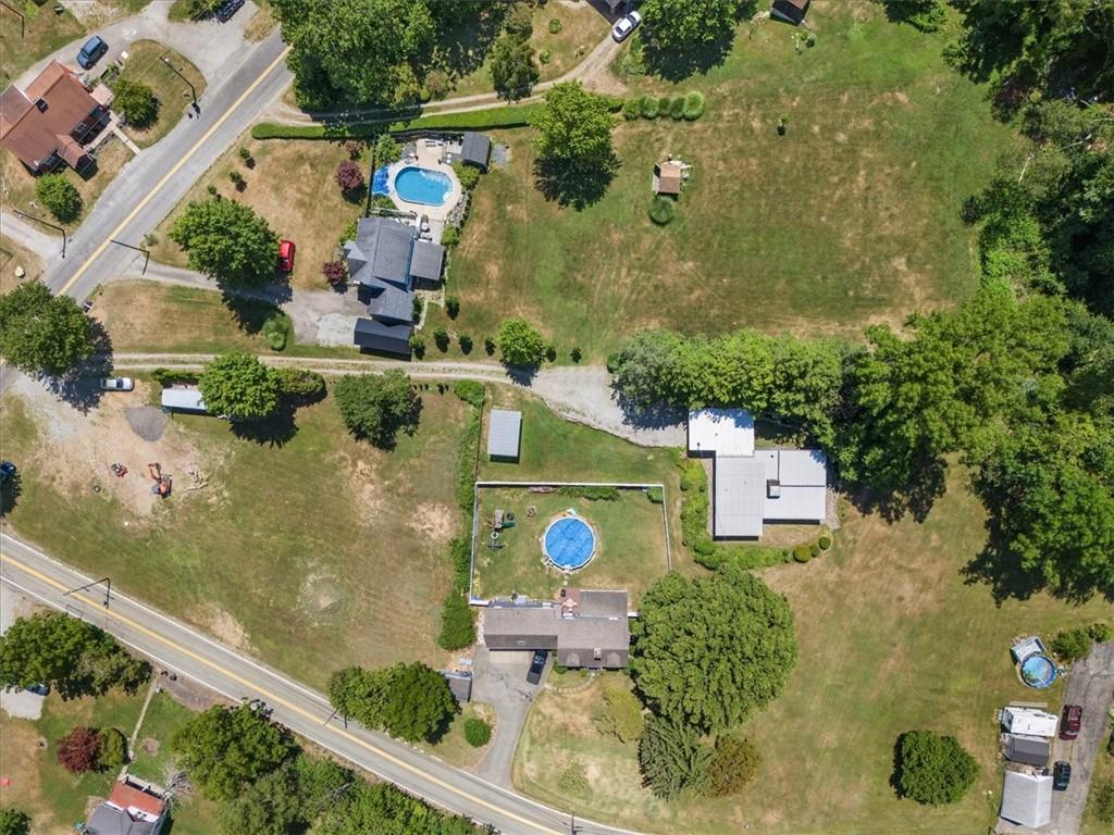 1143 Altman Road Jeannette, PA 15644 - Photo 39 of 50 an aerial view of a house with a yard and pool
