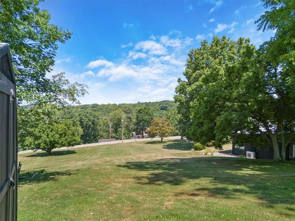 1143 Altman Road Jeannette, PA 15644 - Photo 45 of 50 a view of a grassy field with trees