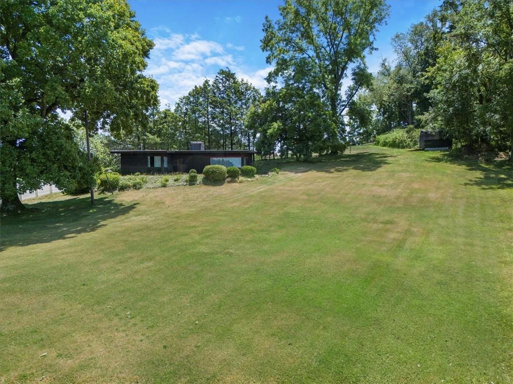 1143 Altman Road Jeannette, PA 15644 - Photo 46 of 50 a backyard of a house with lots of green space