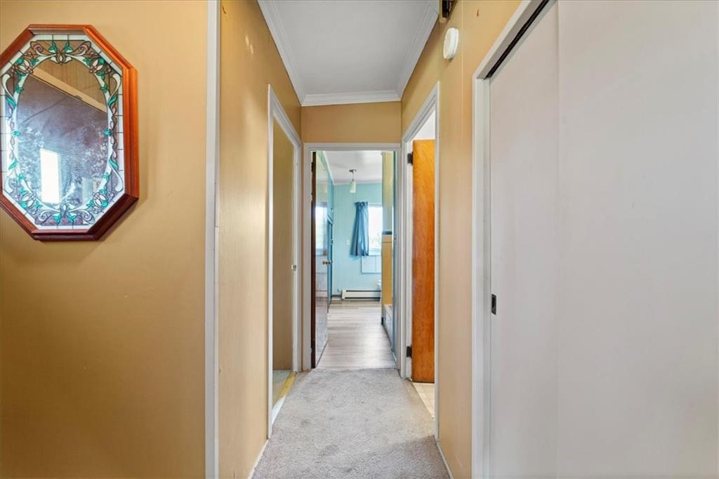 1143 Altman Road Jeannette, PA 15644 - Photo 8 of 50 a view of a hallway with wooden shelves