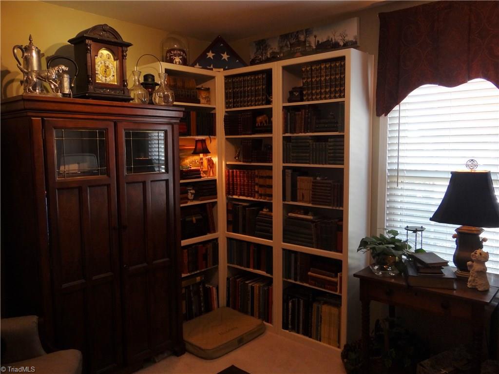 2207 Acorn Ridge Road Greensboro, NC 27407 - Photo 15 of 18 2nd bedroom used as a library. Bookshelves can be removed if buyer does not want them.