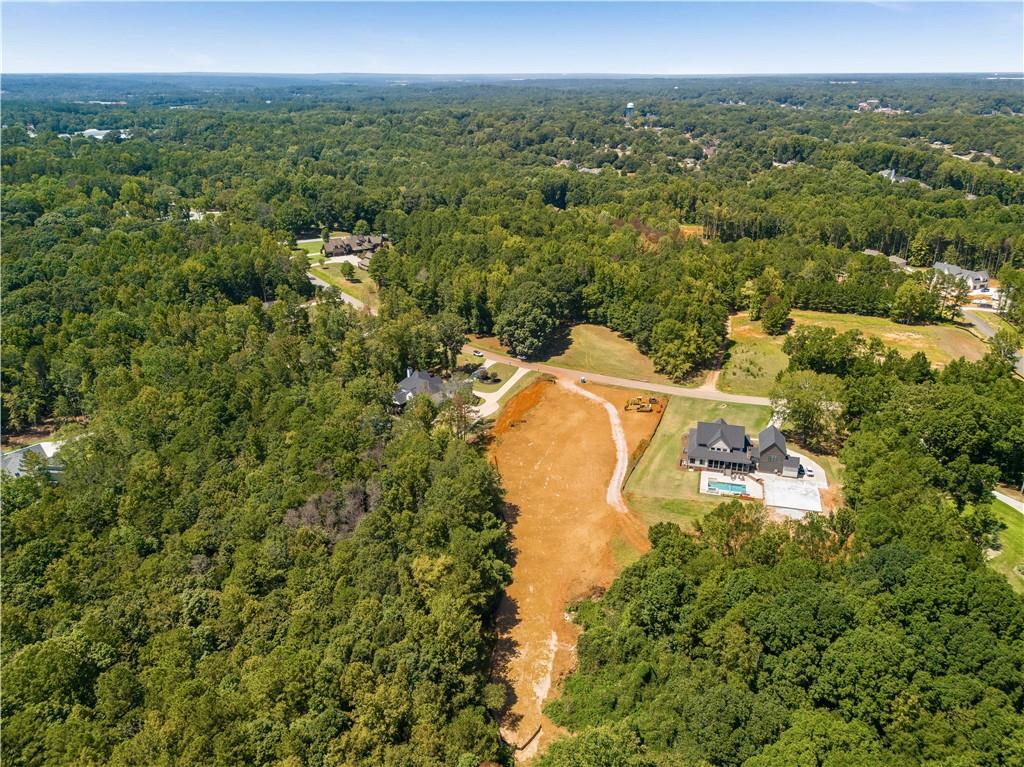642 Canter Way Jefferson, GA 30549 - Photo 7 of 7 an aerial view of residential houses with outdoor space and trees