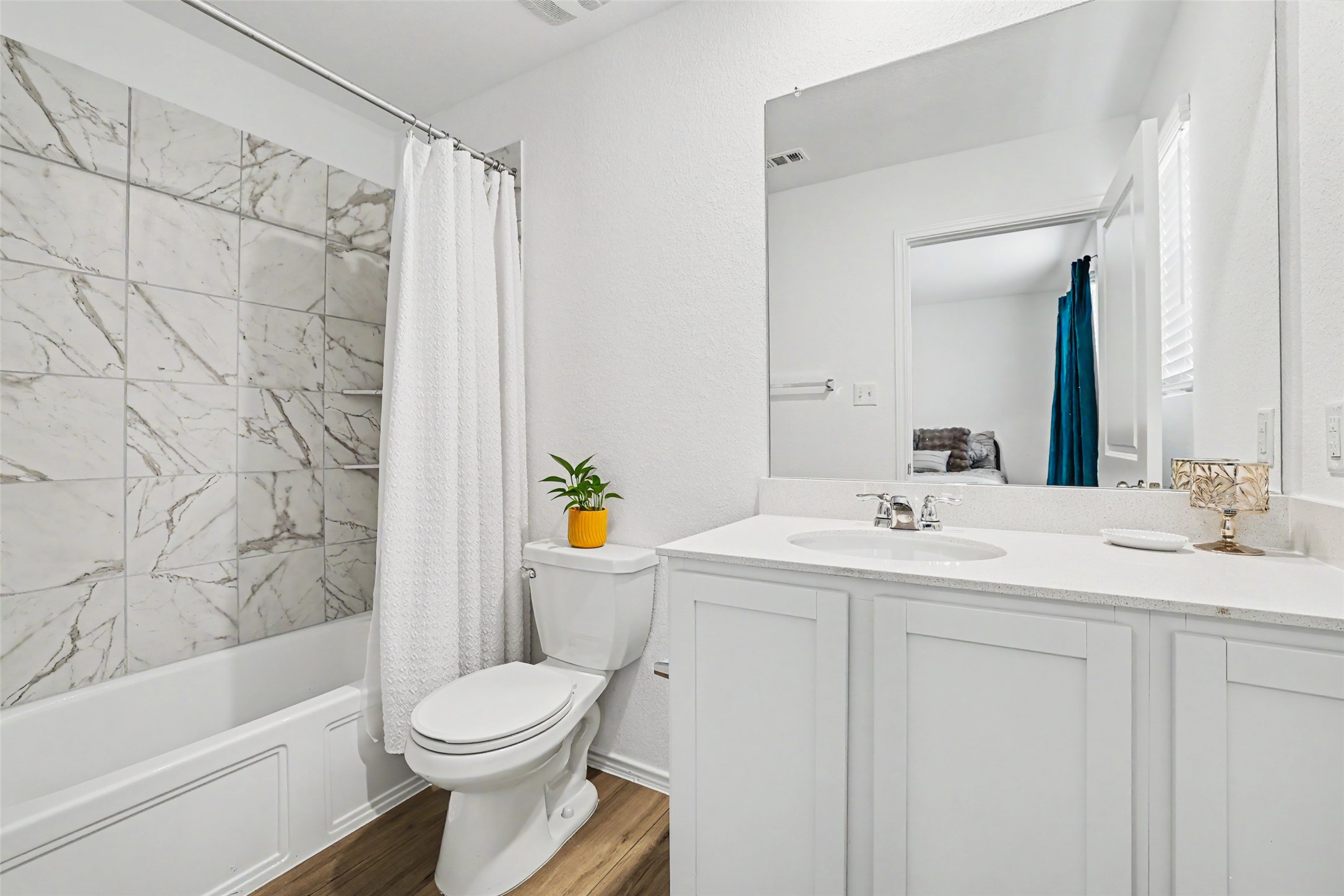 2333 Four Waters Loop Georgetown, TX 78628 - Photo 26 of 35 Bathroom featuring a white vanity with a quartz countertop and integrated sink