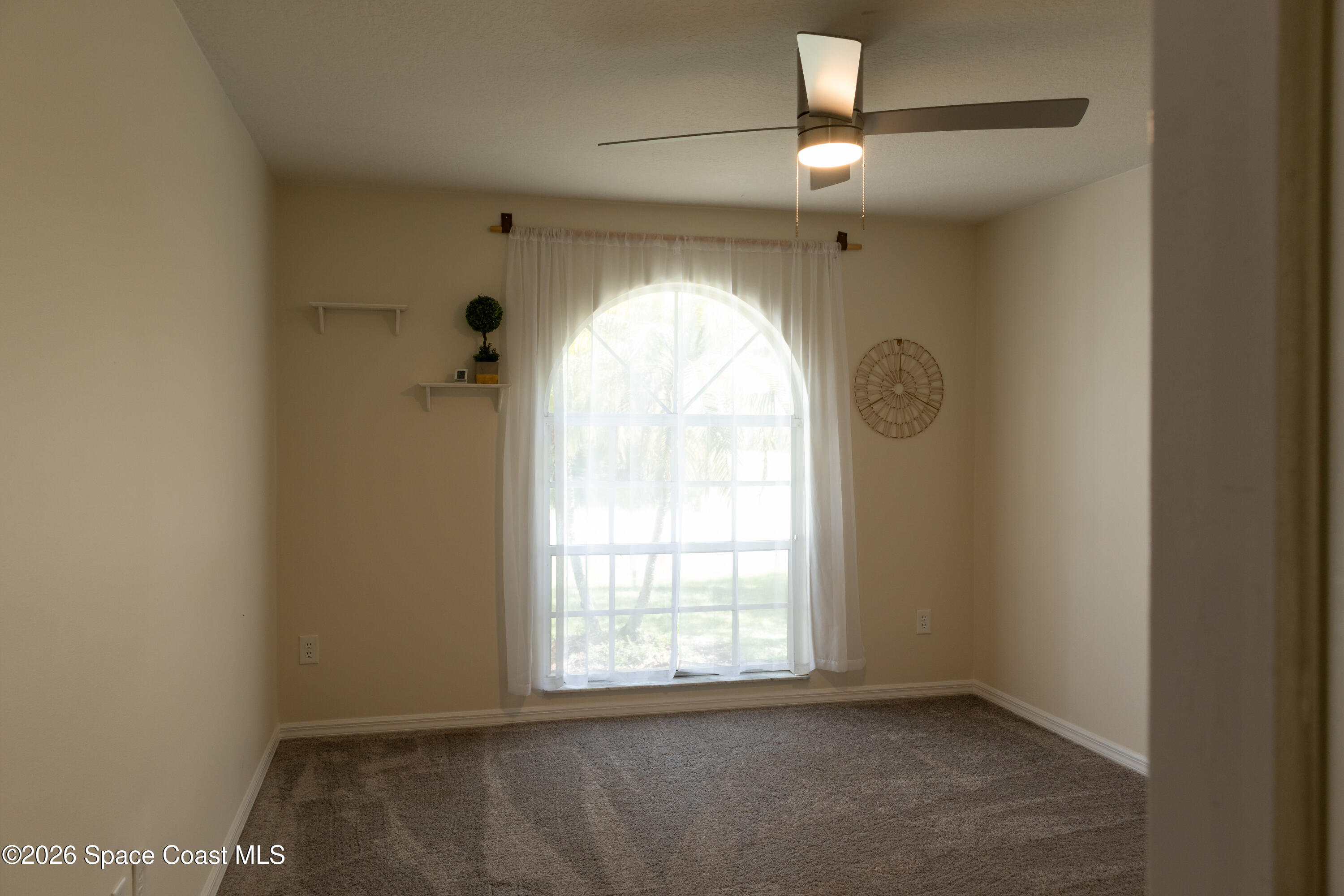 1572 Holbrook Road Northwest Palm Bay, FL 32907 - Photo 12 of 38 a view of empty room with window