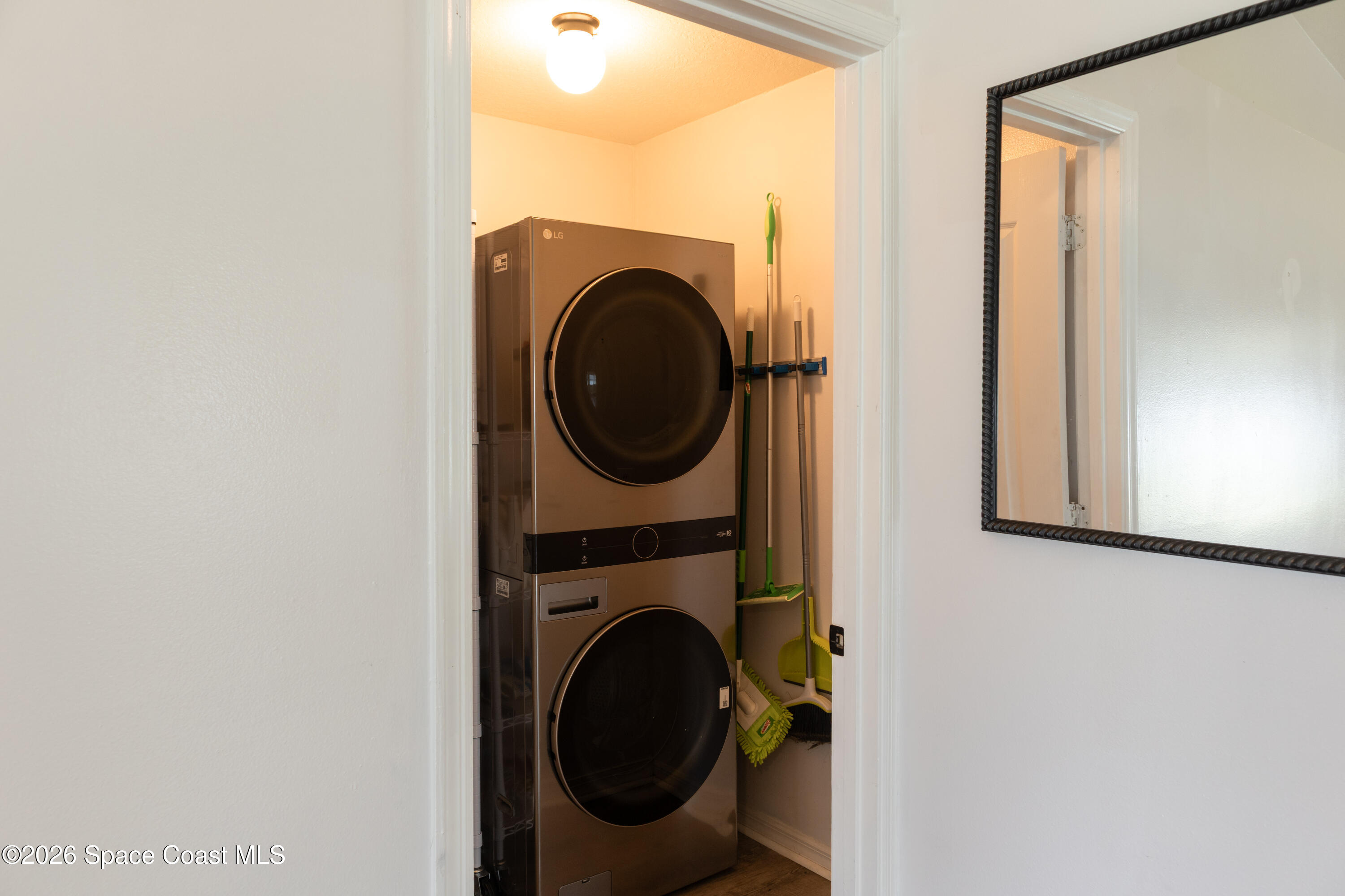 1572 Holbrook Road Northwest Palm Bay, FL 32907 - Photo 25 of 38 a utility room with dryer and washer