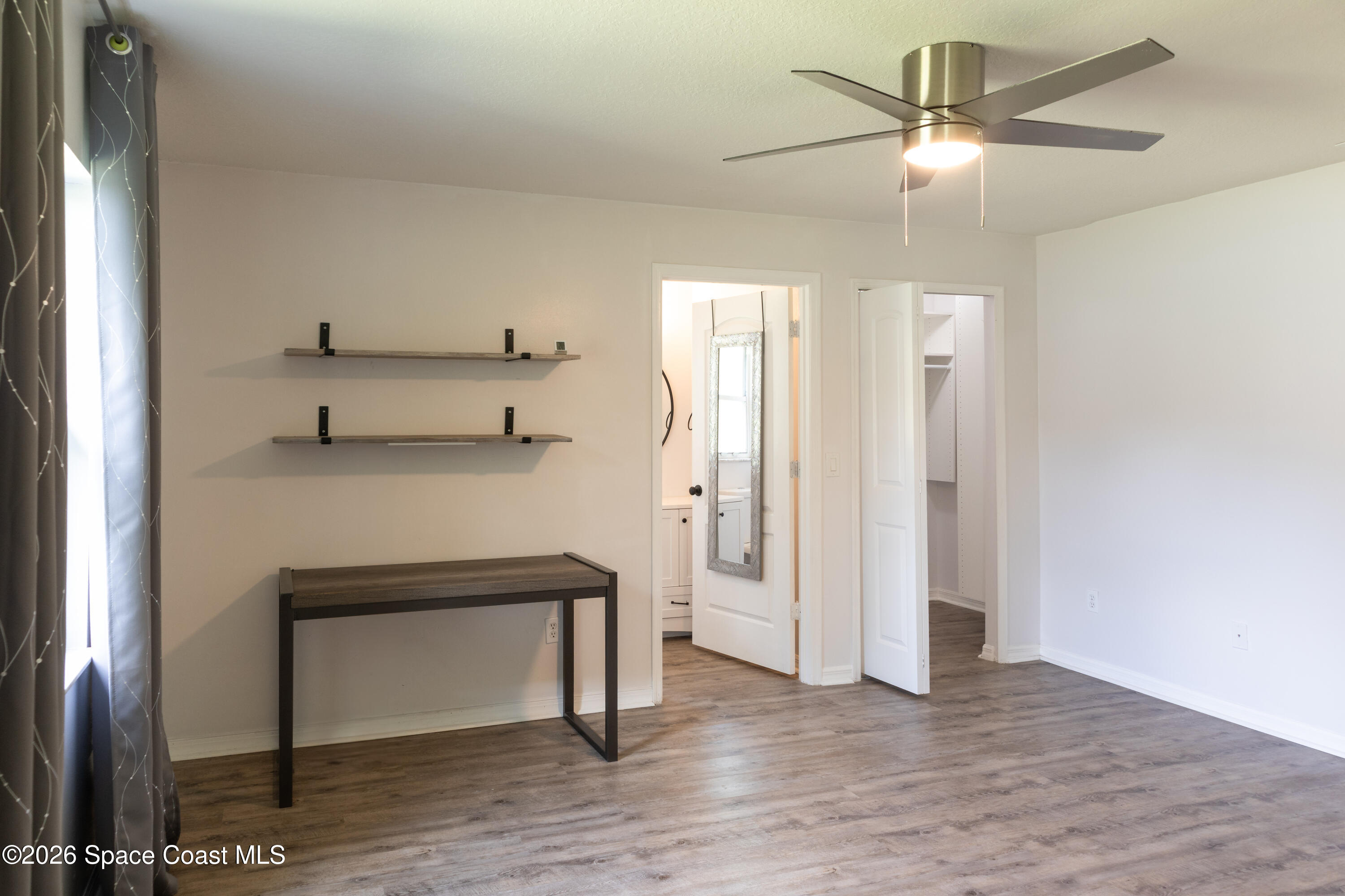 1572 Holbrook Road Northwest Palm Bay, FL 32907 - Photo 29 of 38 a view of entryway and hall with wooden floor