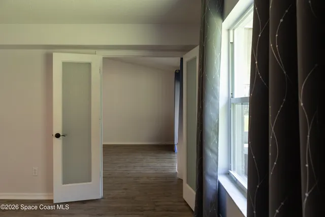 a view of a back yard from a balcony