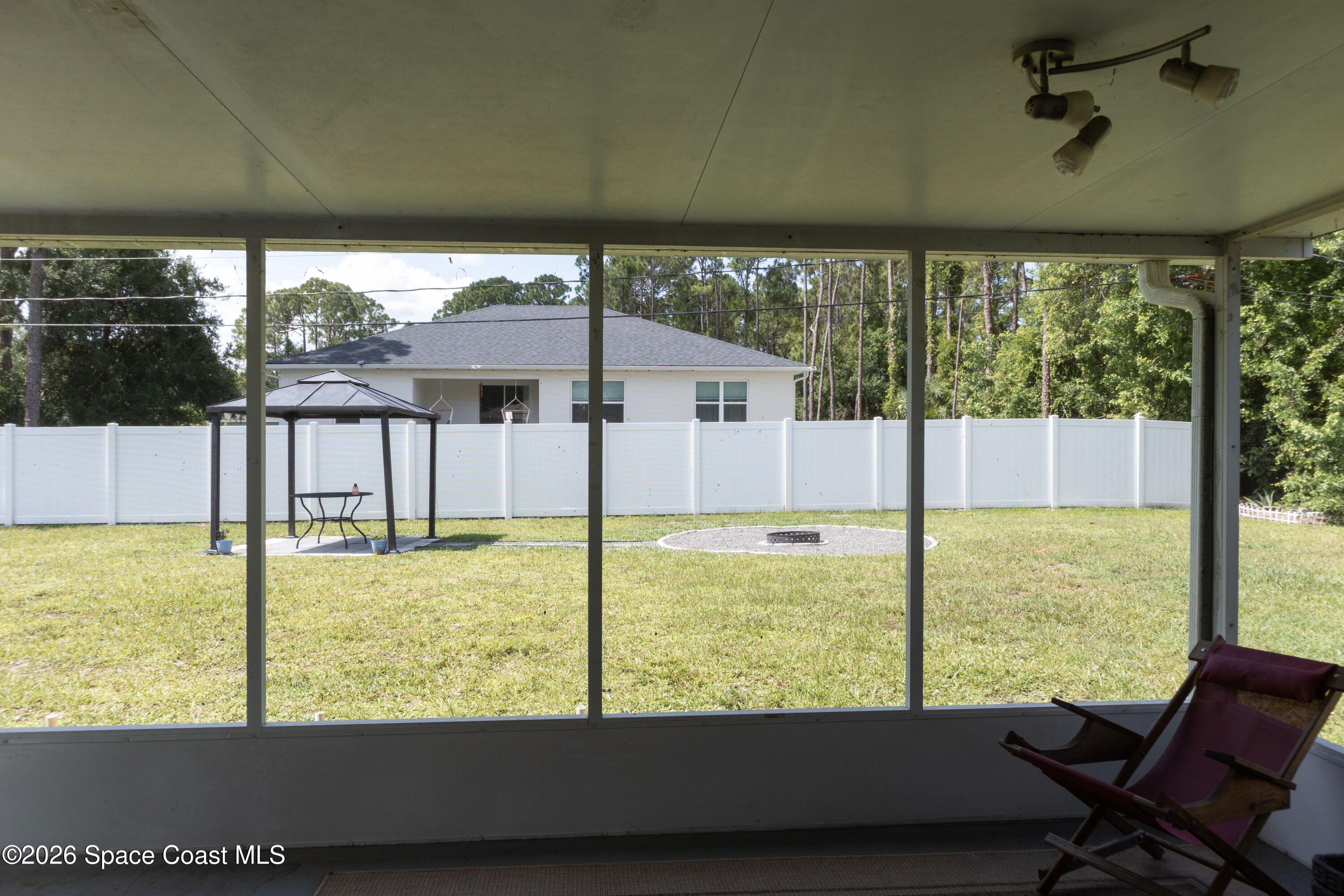 1572 Holbrook Road Northwest Palm Bay, FL 32907 - Photo 35 of 38 a view of a back yard from a balcony