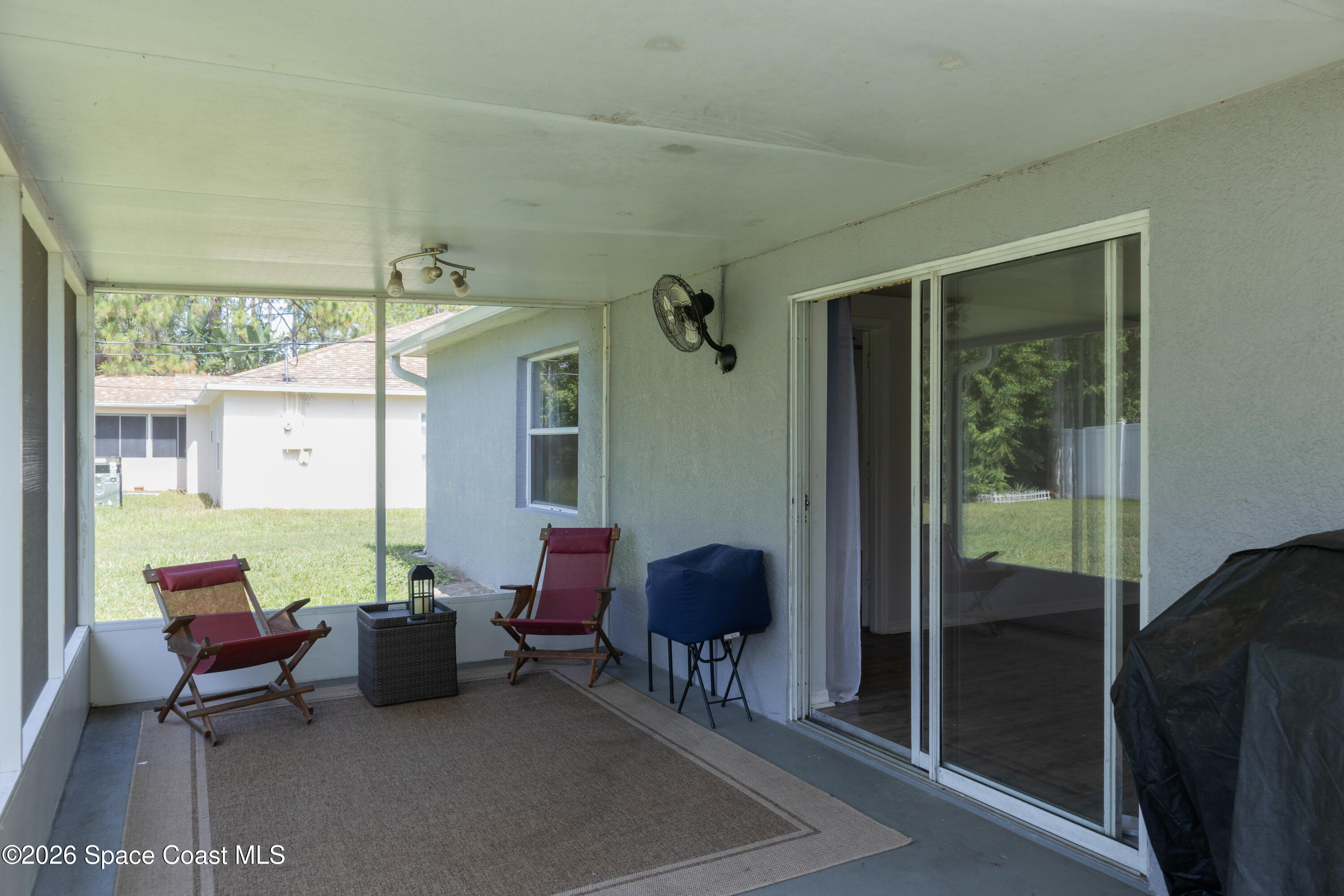 1572 Holbrook Road Northwest Palm Bay, FL 32907 - Photo 36 of 38 a outdoor living space with furniture