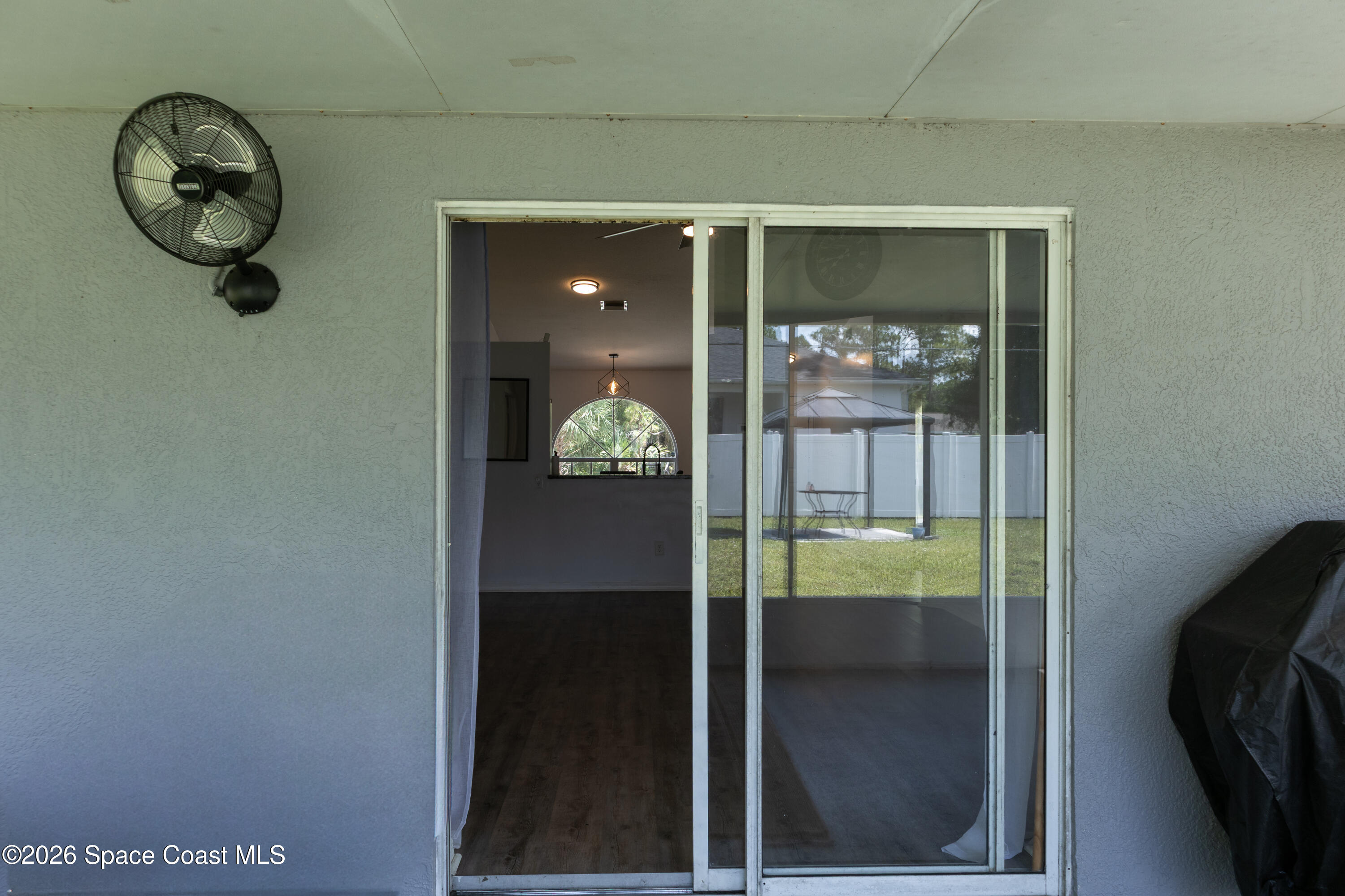 1572 Holbrook Road Northwest Palm Bay, FL 32907 - Photo 38 of 38 a glass door with a glass door and a hallway