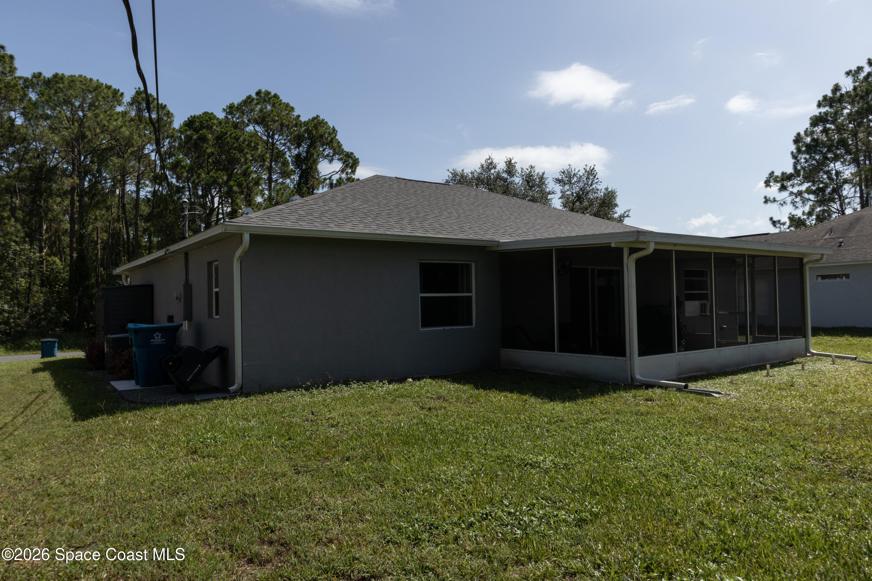 1572 Holbrook Road Northwest Palm Bay, FL 32907 - Photo 4 of 38 a view of a house with a yard