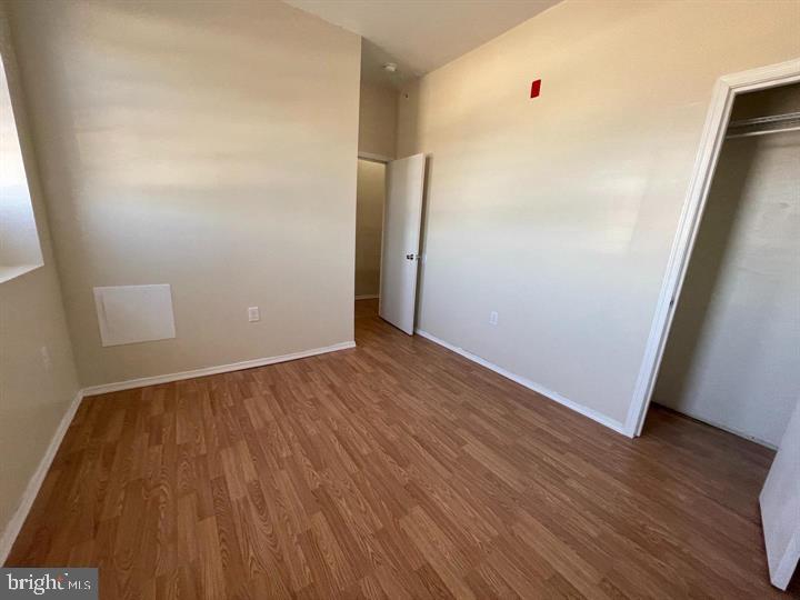 4726 Chestnut Street, Unit 8 Philadelphia, PA 19139 - Photo 3 of 9 wooden floor in an empty room
