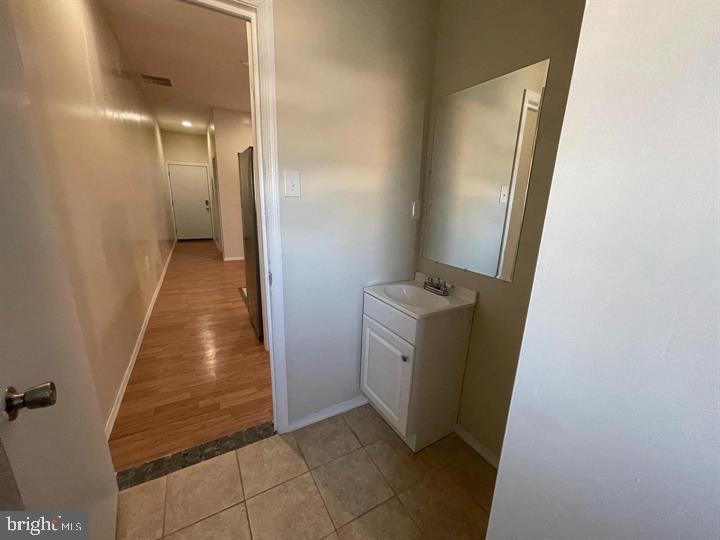 4726 Chestnut Street, Unit 8 Philadelphia, PA 19139 - Photo 7 of 9 a view of a hallway with washer and dryer