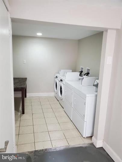 4726 Chestnut Street, Unit 8 Philadelphia, PA 19139 - Photo 9 of 9 a utility room with dryer and washer