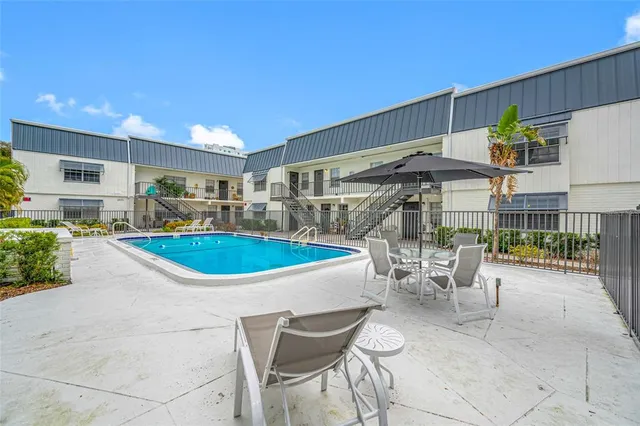 a outdoor space with lots of table and chairs