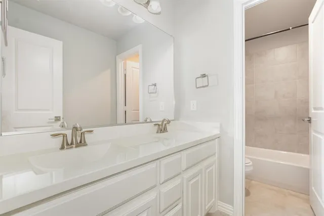 a view of a house with a backyard and a large window