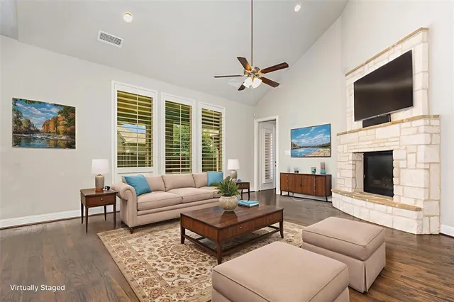 a living room with fireplace furniture and a flat screen tv