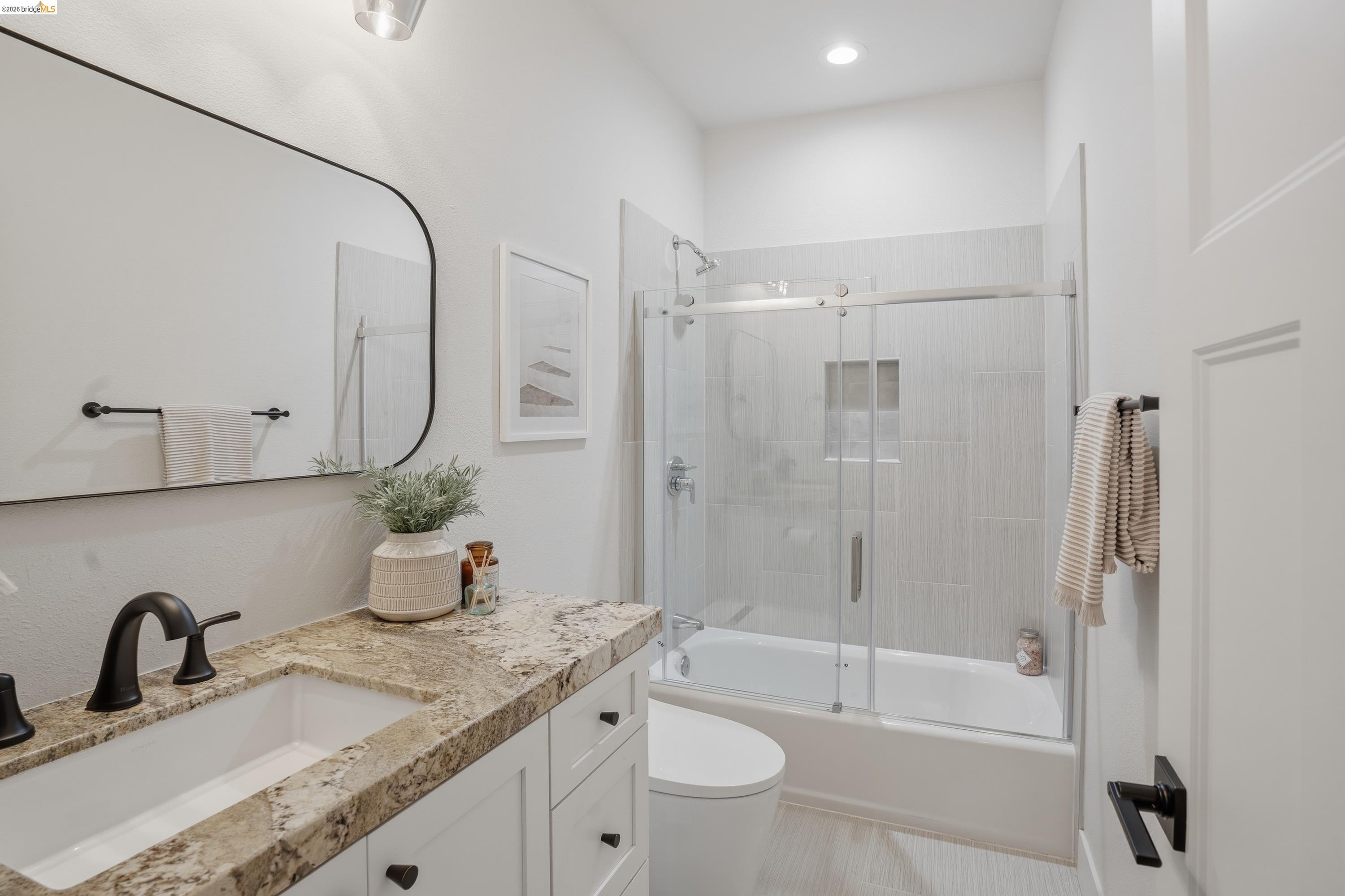 4120 Happy Valley Road Lafayette, CA 94549 - Photo 22 of 33 Bathroom featuring a white vanity with a light-colored stone countertop, an integrated rectangular sink, and matte black fixtures
