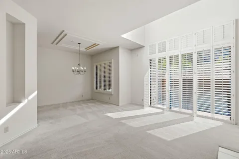 a view of empty room with wooden floor and fireplace