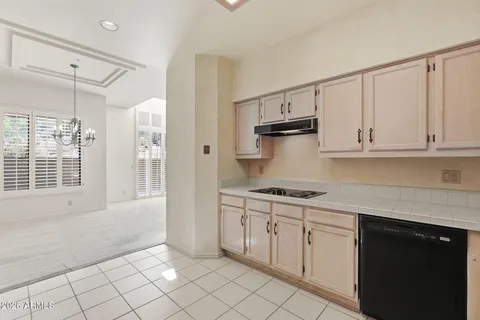 a kitchen with a sink and refrigerator