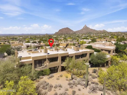 an aerial view of residential houses with outdoor space