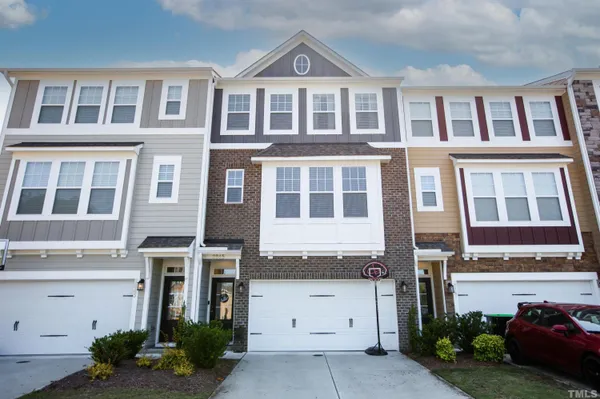 a front view of a building with a yard