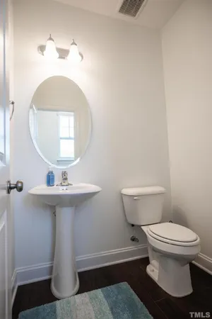 a room with furniture and two windows